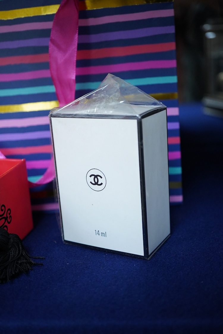 An unopened bottle of Chanel No.22 perfume, together with a boxed Paloma Picasso lipstick